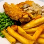Pub Style Chicken and Mushroom Pie served with chips and peas