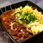 Slow cooker chilli with rice, cheddar cheese and sour cream