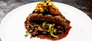 Read more about the article Butchers Sausages with Braised Puy Lentils, Buttered Cabbage and Caramelised Onions