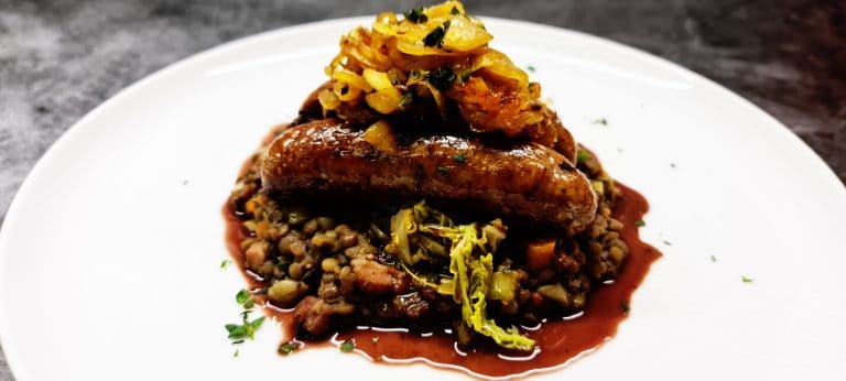 Read more about the article Butchers Sausages with Braised Puy Lentils, Buttered Cabbage and Caramelised Onions